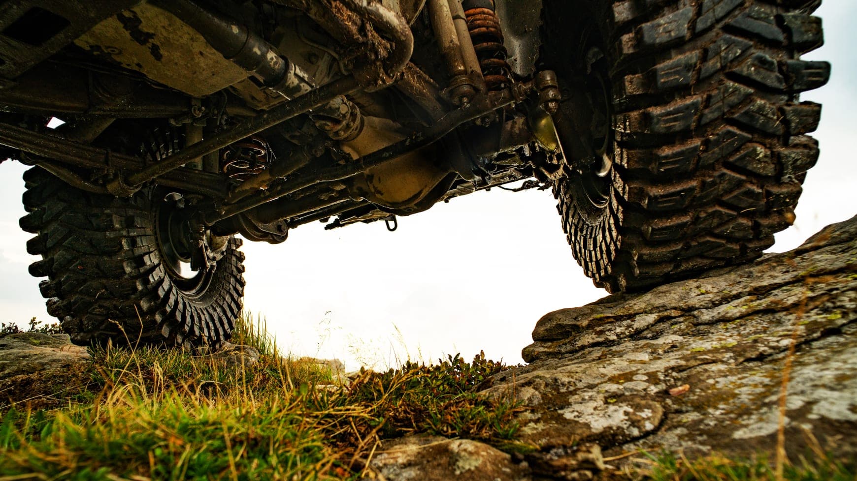 Vehicle Using Off The Road Tires on a Rocky Hillside